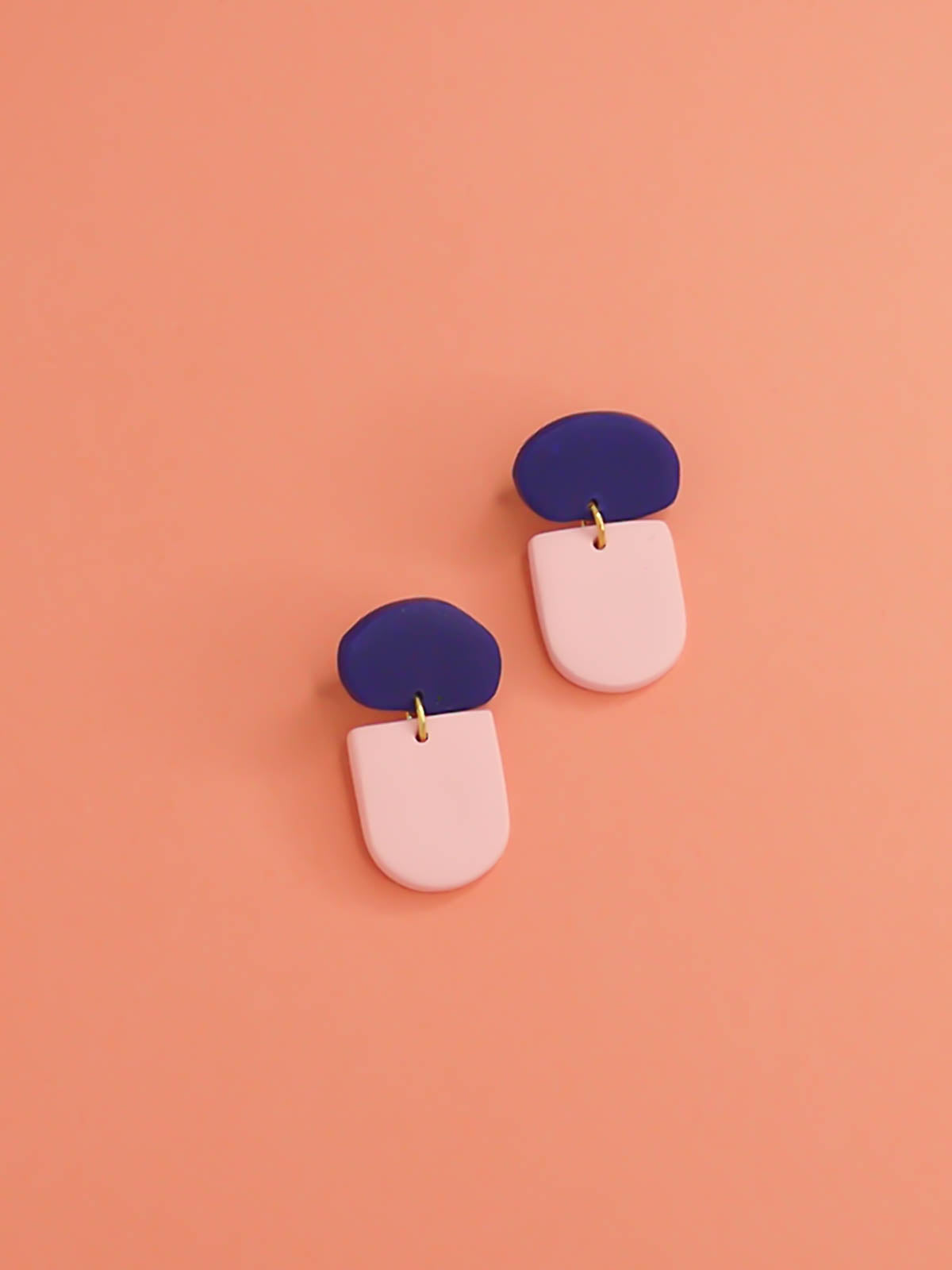 Pink arch dangle earrings with an organic rectangle shaped stud with stainless steel earring posts