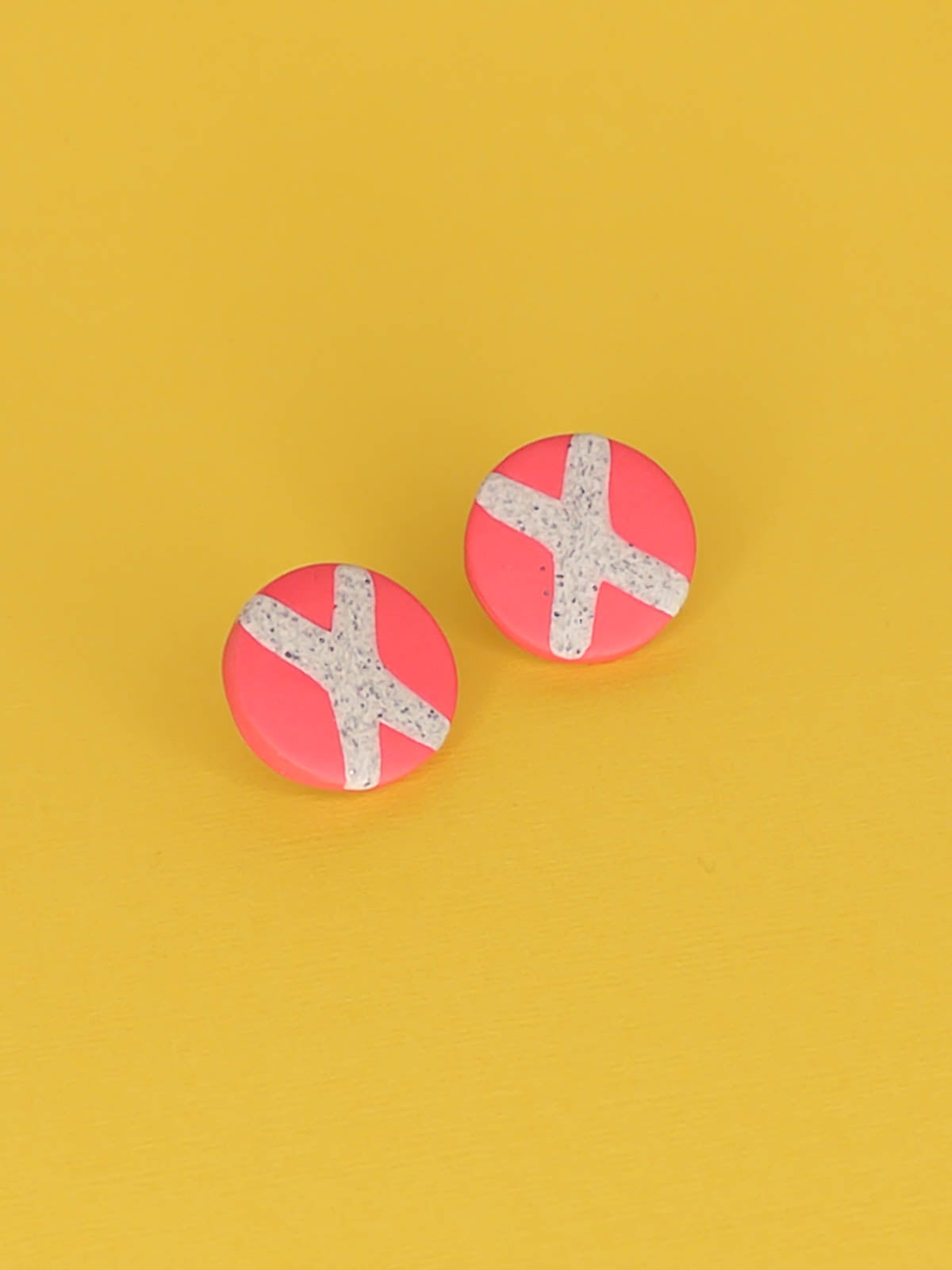 Lightweight geometric pink polymer clay stud circle earrings with a granite cross in the centre