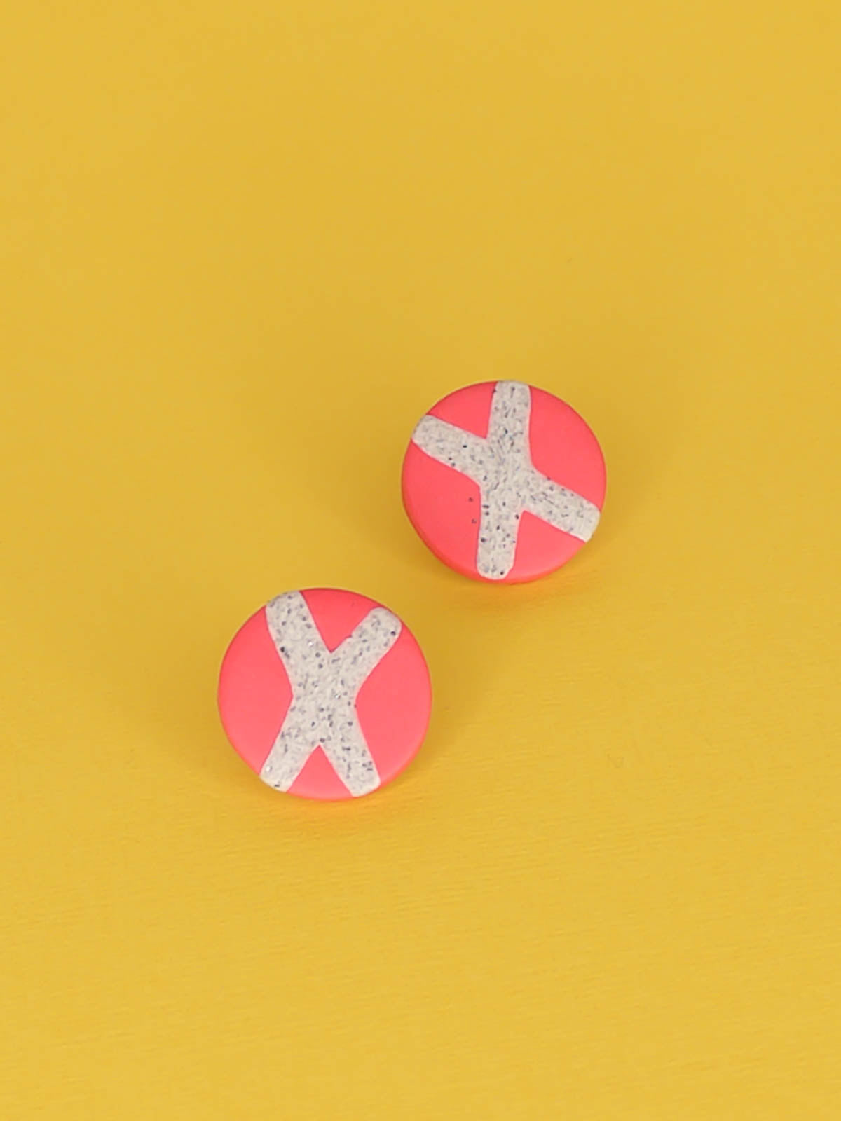 Lightweight geometric pink polymer clay stud circle earrings with a granite cross in the centre