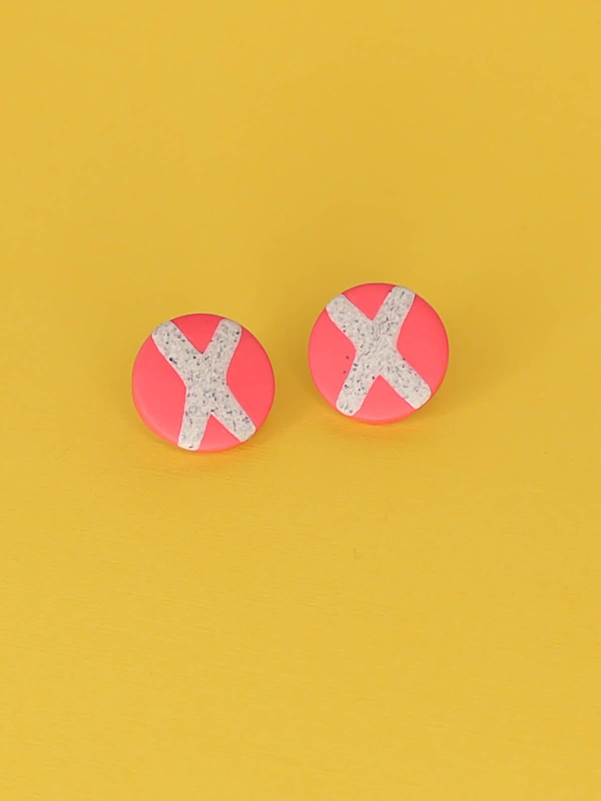 Lightweight geometric pink polymer clay stud circle earrings with a granite cross in the centre