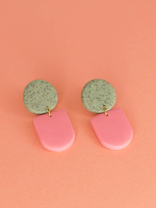 Lightweight statement arch dangle earrings with a pink arch and green granite stud, with stainless steel posts, handmade out of polymer clay