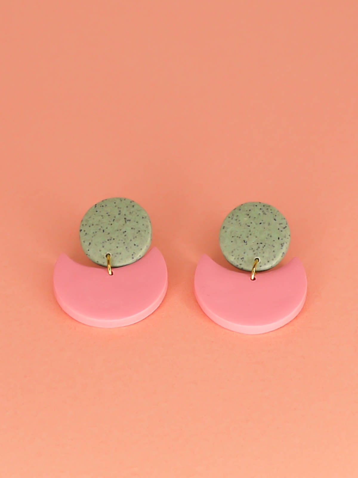 Geometric pink & green crescent statement earrings with a green granite stud and a pink semi circle, with stainless steel posts, handmade from polymer clay.