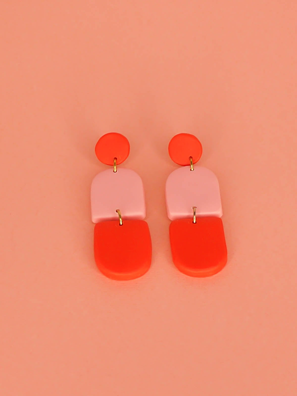 Colour block polymer clay pink & red arch dangle earrings with a red stud and stainless steel posts