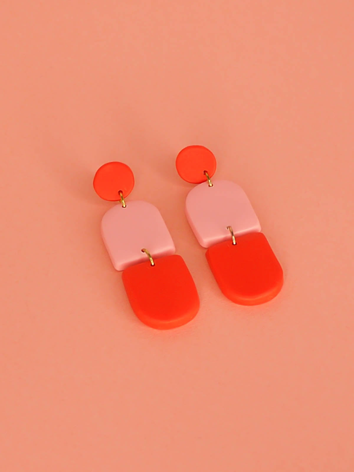 Colour block polymer clay pink & red arch dangle earrings with a red stud and stainless steel posts