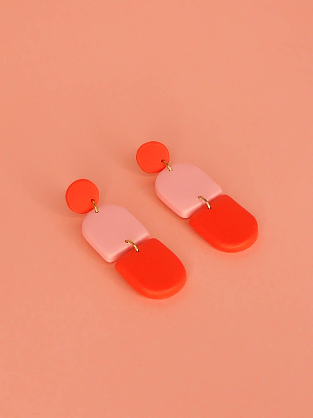 Colour block polymer clay pink & red arch dangle earrings with a red stud and stainless steel posts