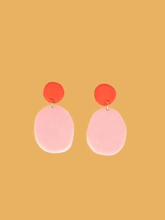 Colour block polymer clay pebble earrings in pink with a red stud and stainless steel posts
