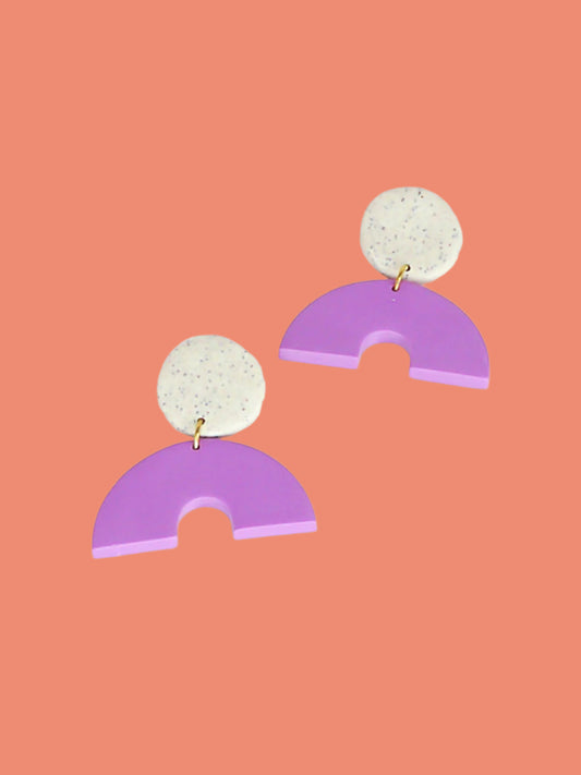 Geometric arch dangle earrings with a purple arch connected to a granite stud with stainless steel posts, made out of lightweight polymer clay