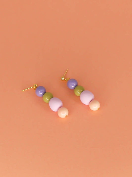 Pastel colour block bead drop earrings in purple, green & pink glass beads with a hand rolled lilac polymer clay bead hung from 24k gold plated ball studs