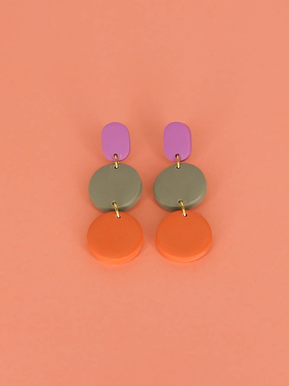 Colour block 3-tier polymer clay dangle earrings in a purple rectangle stud, connected to a sage & orange circle