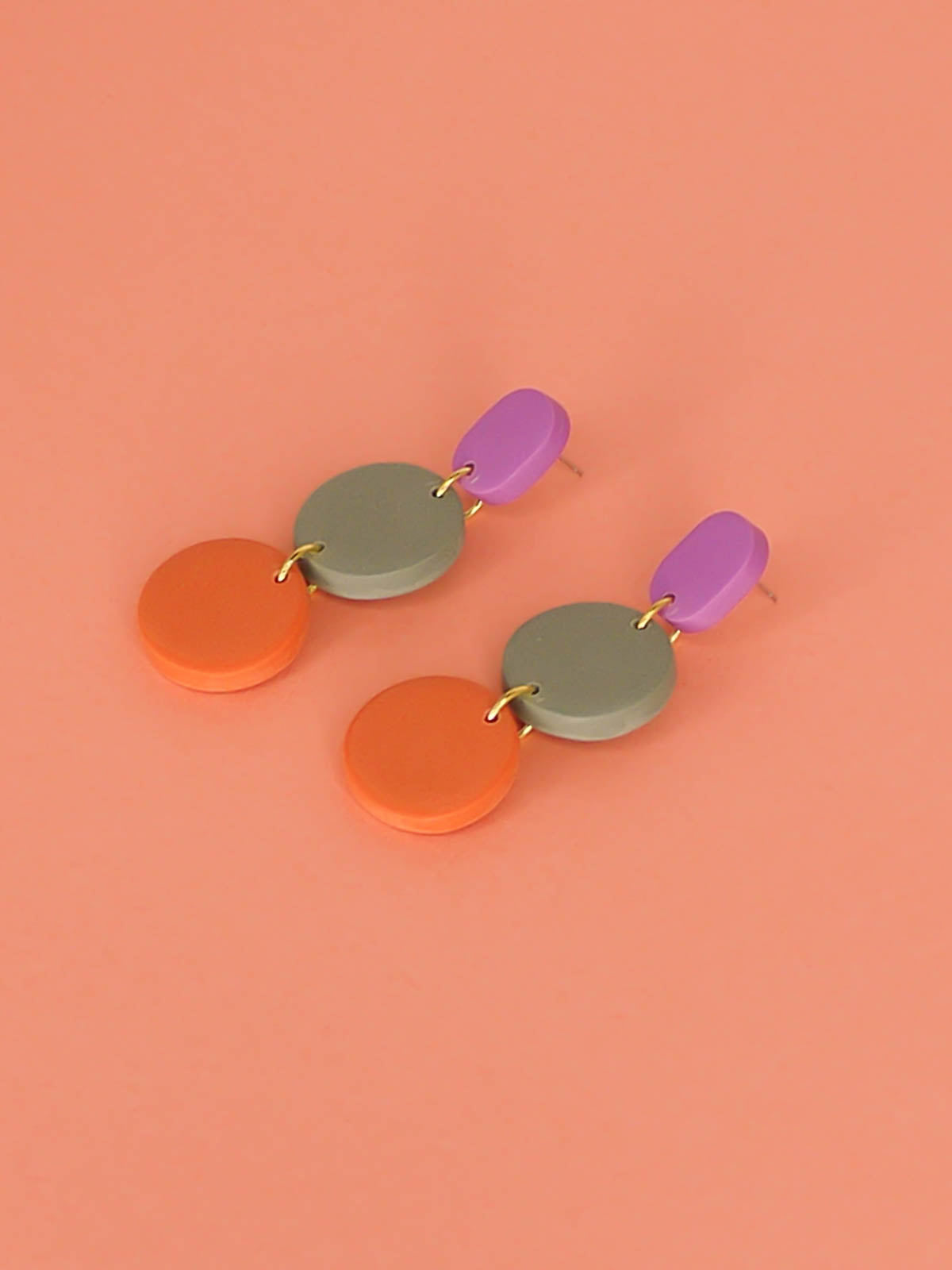 Colour block 3-tier polymer clay dangle earrings in a purple rectangle stud, connected to a sage & orange circle