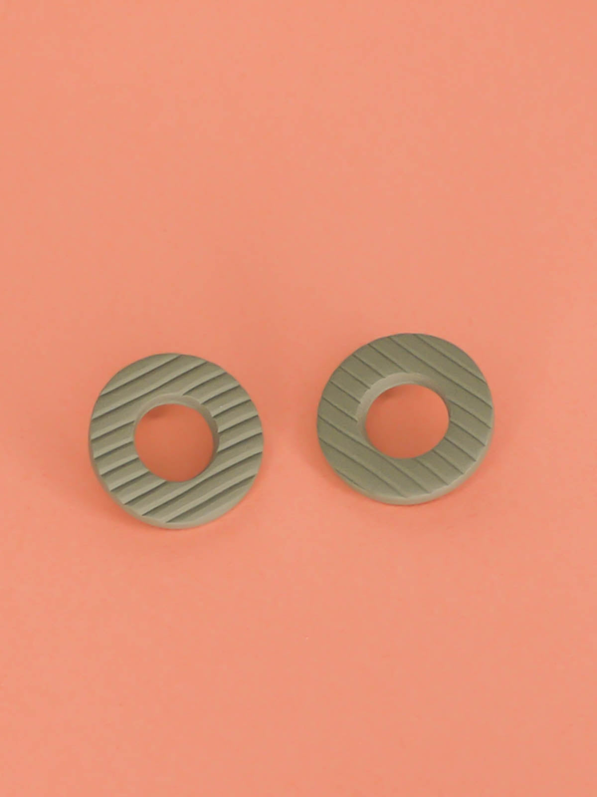 Sage green textured stripe hoop stud earrings, made out of polymer clay with stainless steel posts