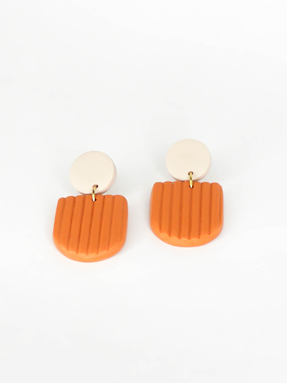 Modern arch dangle statement earrings in terracotta textured striped arch with a beige stud, made out of polymer clay with a stainless steel posts.