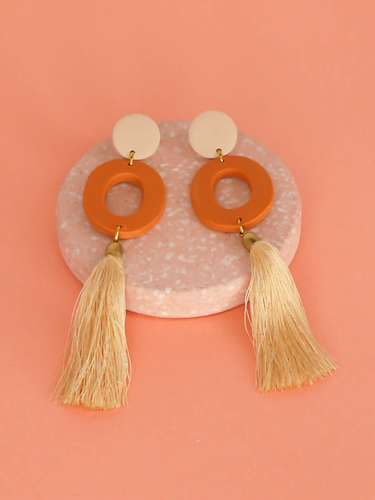 Long lightweight 3 tier tassel statement earrings with a polymer clay beige stud, connected to a terracotta hoop & a beige tassel