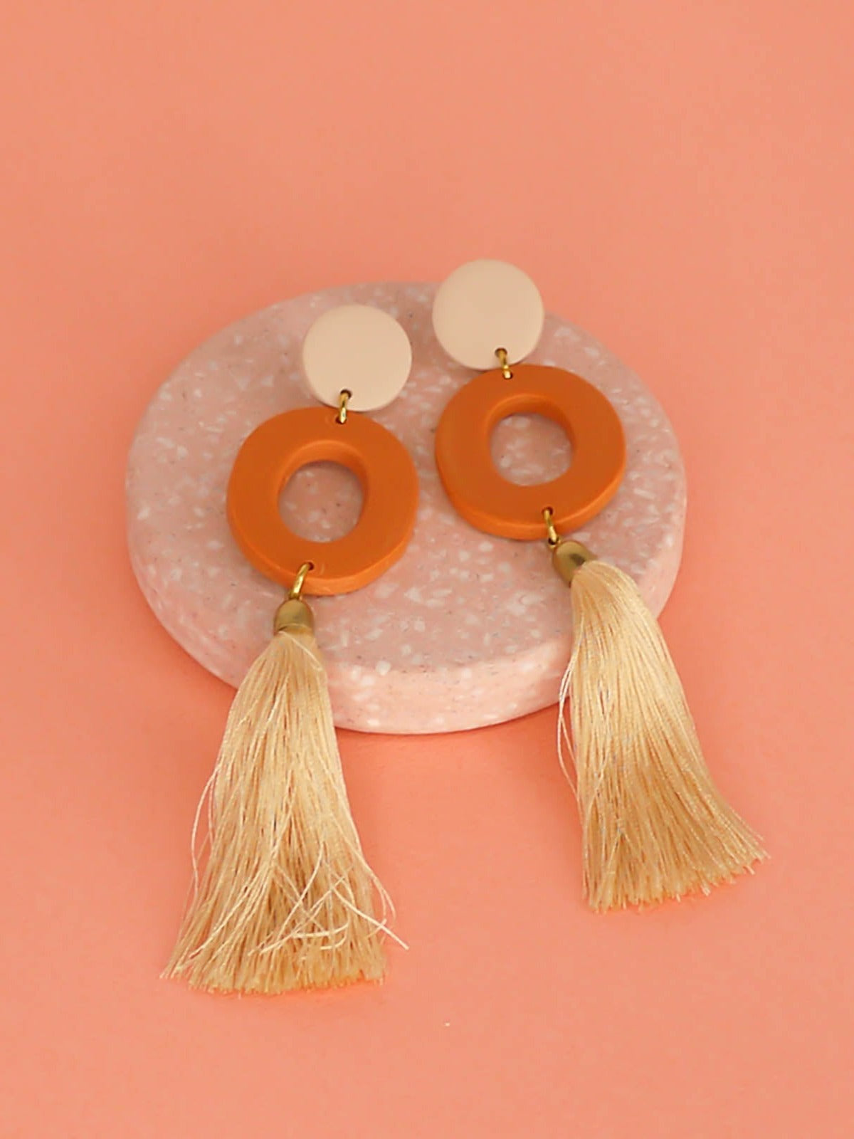 Long lightweight 3 tier tassel statement earrings with a polymer clay beige stud, connected to a terracotta hoop & a beige tassel