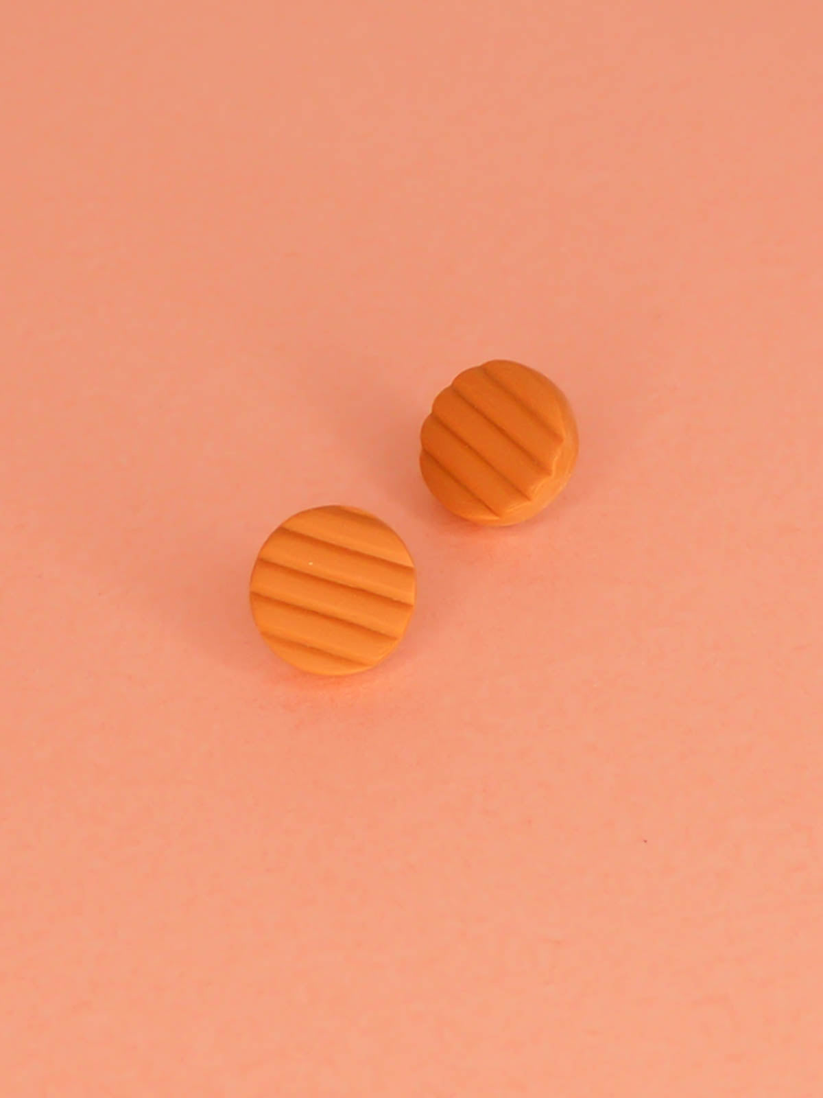 Mini terracotta stud earrings in striped textured lightweight polymer clay