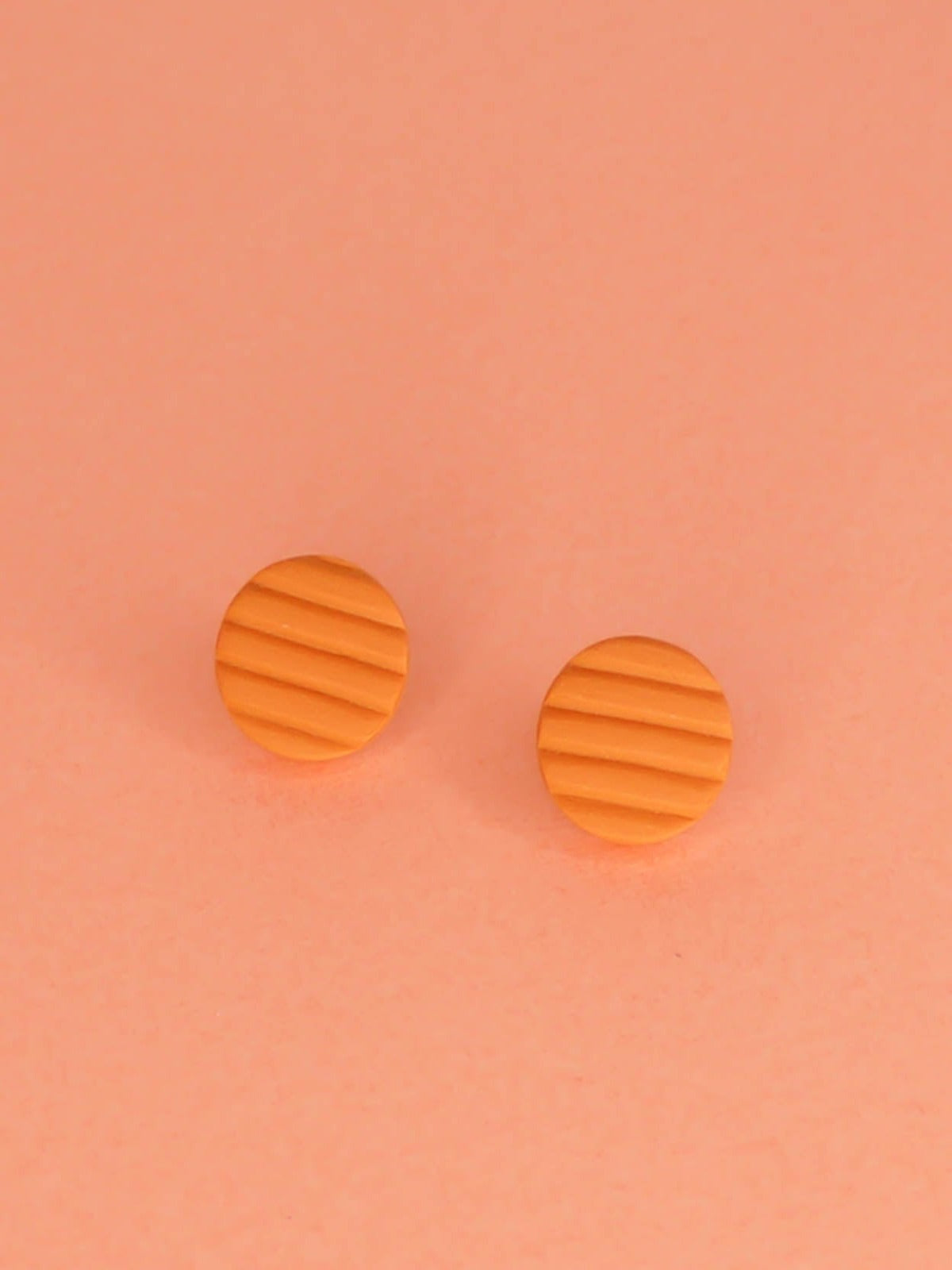 Mini terracotta stud earrings in striped textured lightweight polymer clay