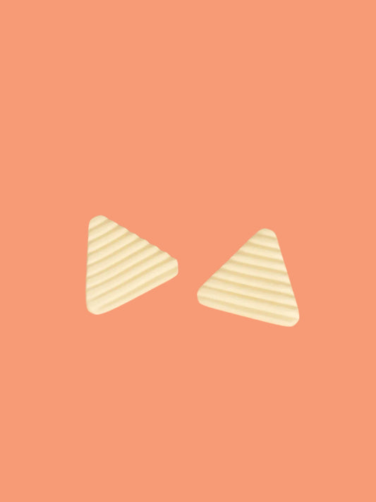 Lightweight yellow polymer clay triangle stud earrings in a fluted striped texture with stainless steel studs.